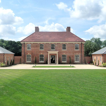 Two new build large traditionally architected houses